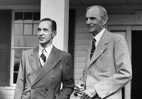 Henry Ford (R) talking with his son, Edsel Ford. Photo by William Vandivert
